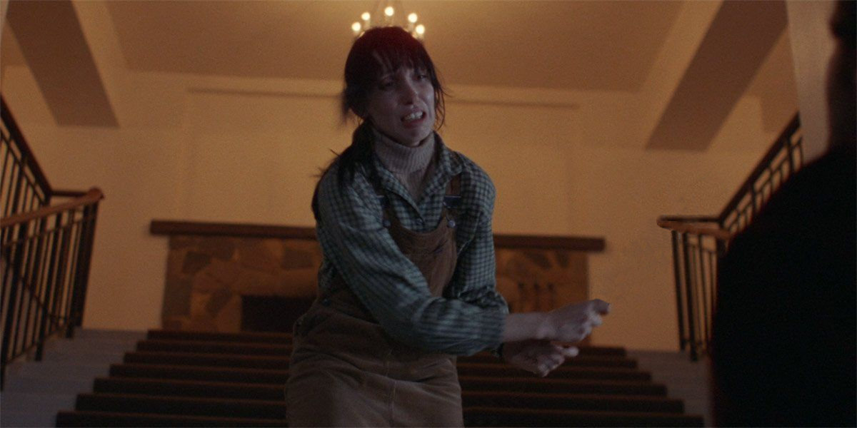 Shelley Duvall - walking backwards up stairs looking a bit worried