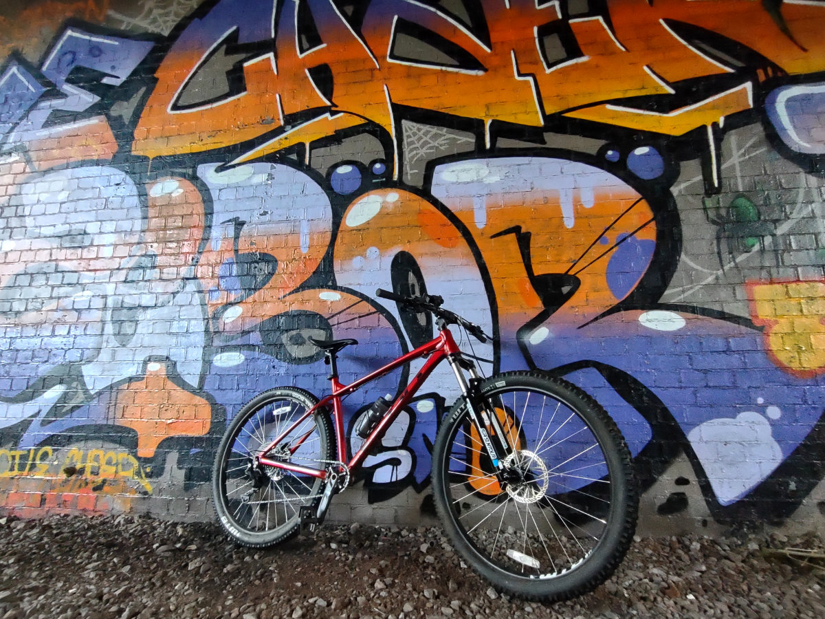 Mountain bike with graffiti backdrop