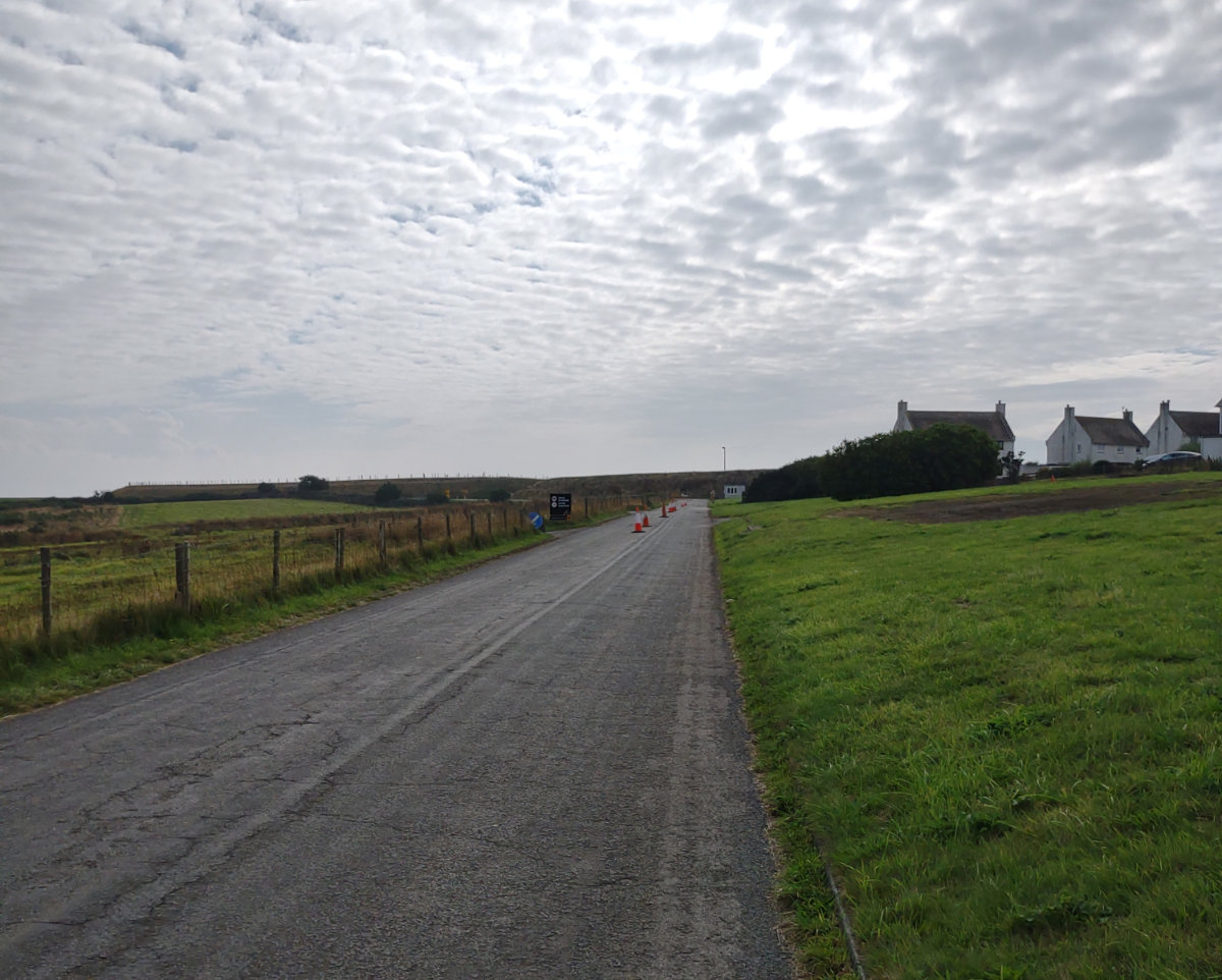 The road to the track - parking on the right behind the houses