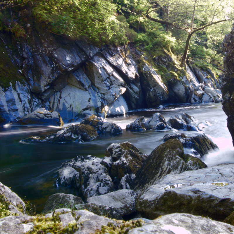 Water wisping between rocks - slow shutter goodness