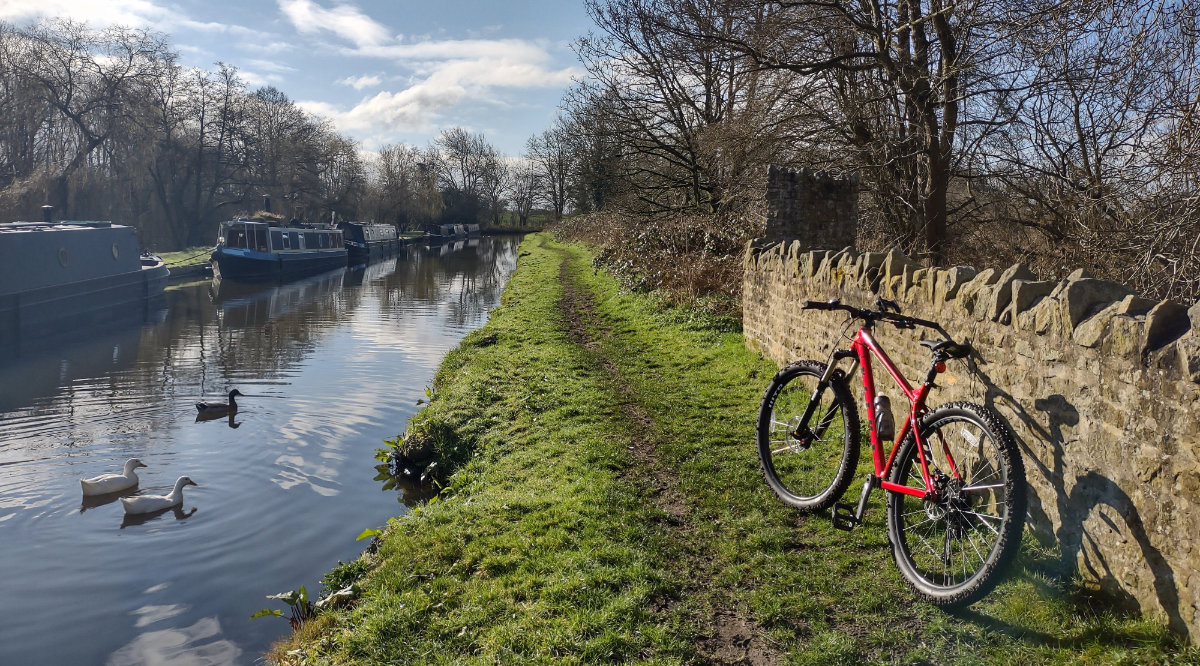 Bike against the wall on a canal towpath